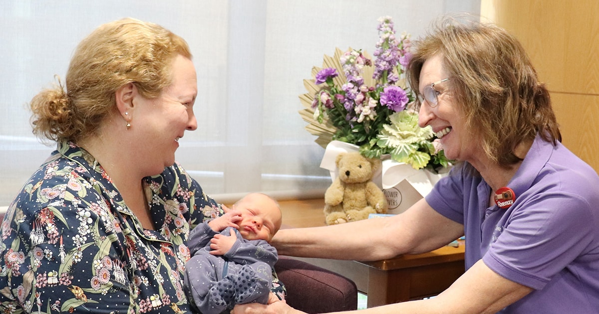 Image of Lactation Consultant with a mother and new baby