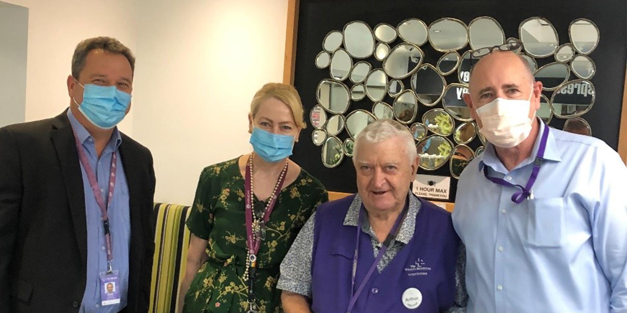 Arthur Walters with hospital staff celebrating 20 years of volunteering