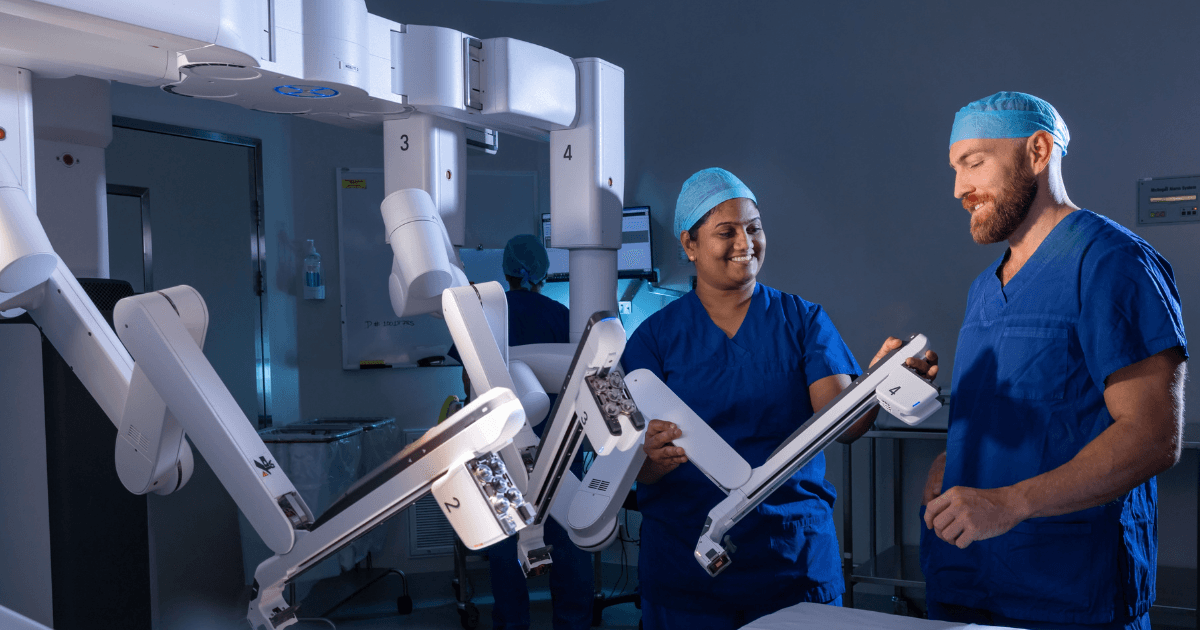 Theatre nurses prepare surgical robot for surgery