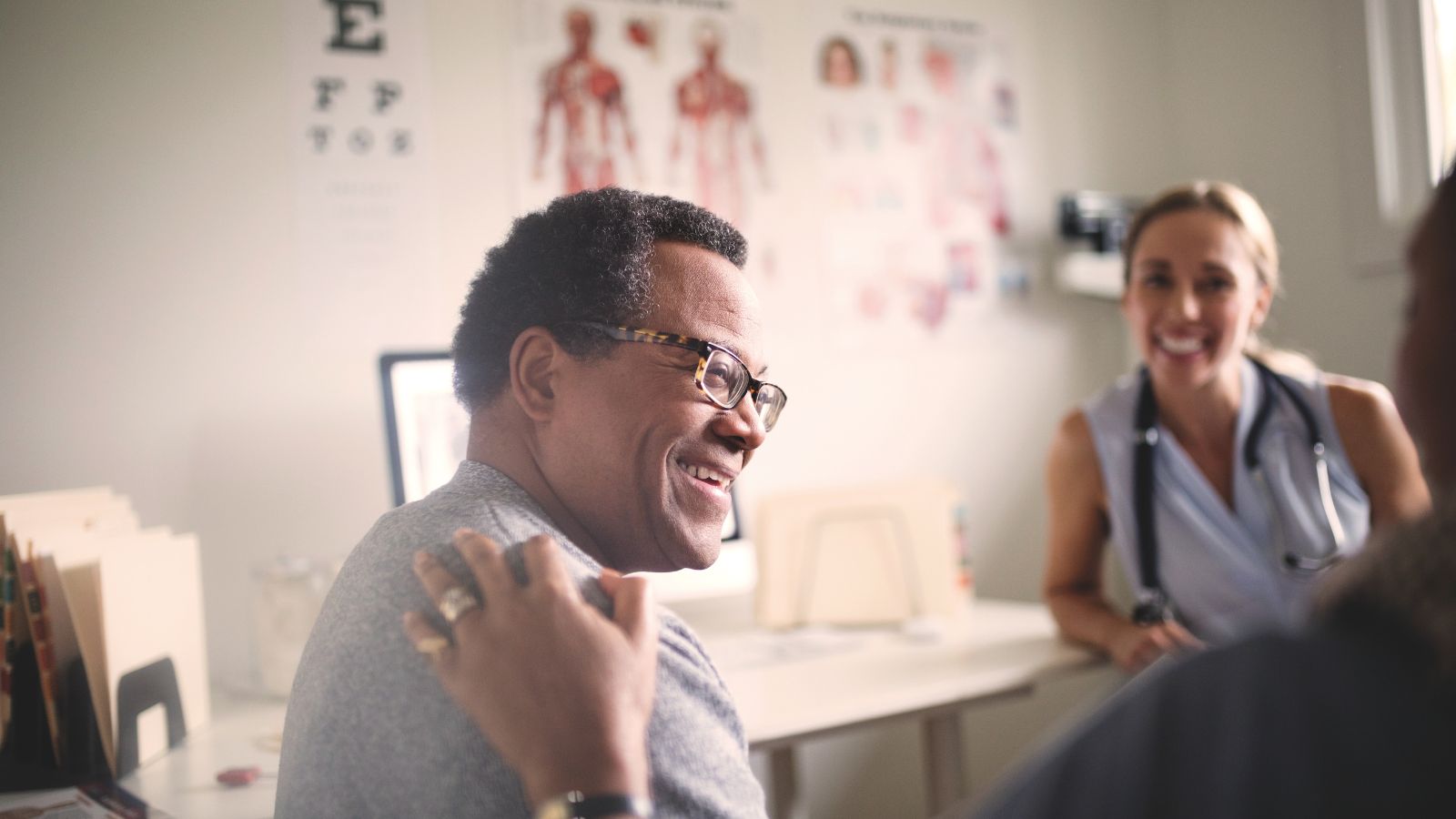 A doctor and smiling patient.
