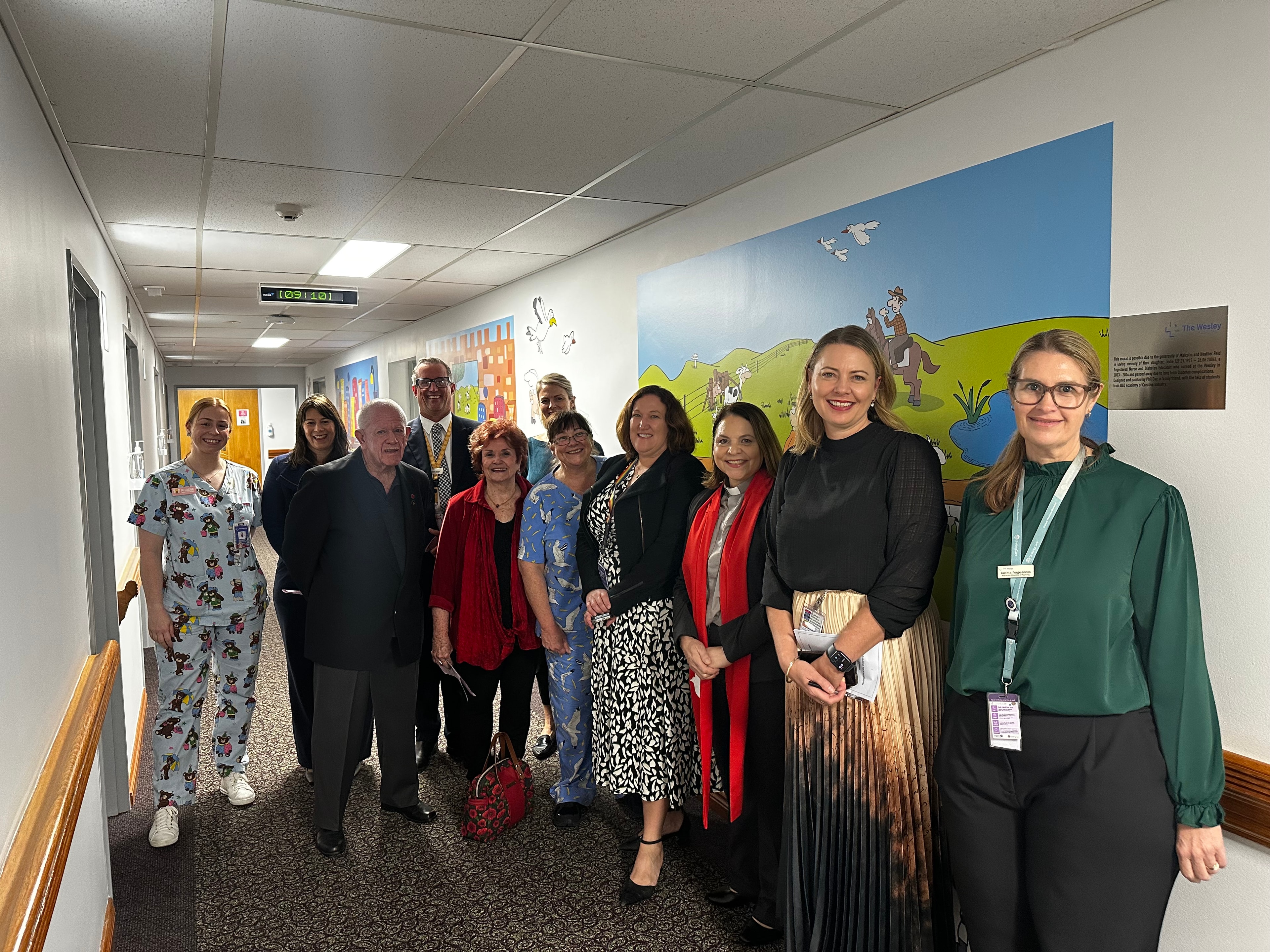 A group of people celebrate the opening of The Wesley Hospital's new paediatric ward.